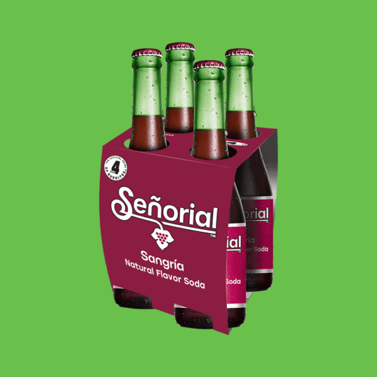 Sangría Señorial four-pack displayed against a bright green background, emphasizing its signature bottles and bold packaging.