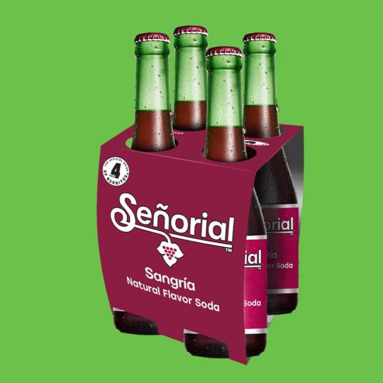 Sangria Senorial four-pack glass bottles with iconic branding, presented as a refreshing premium non-alcoholic soda for sharing.